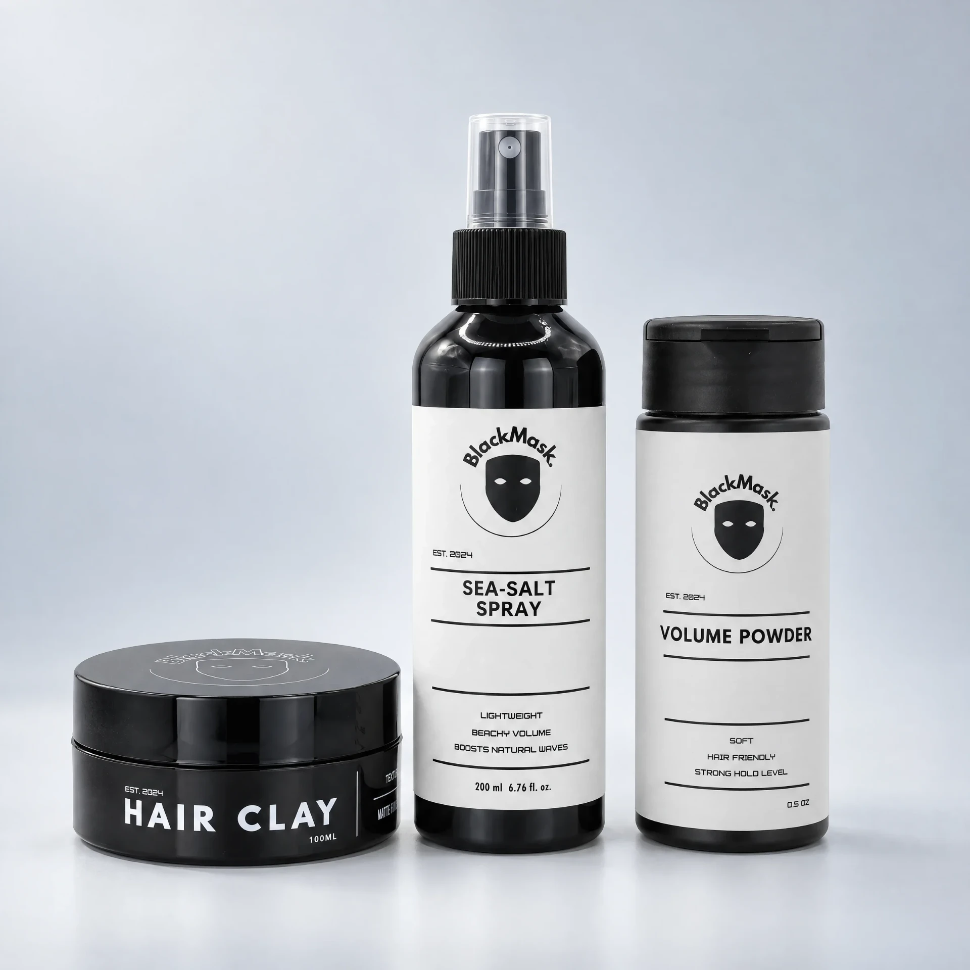 The BLACKMASK bundle together on one shelf: Hair Clay jar, Sea-Salt Spray bottle, and Volume Powder bottle
